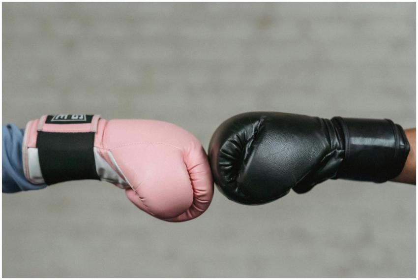 Sid view of crop unrecognizable boxers in protecti