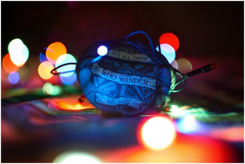 Vibrant bokeh lights surround an object bearing an