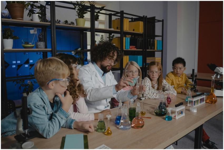 Students explore chemistry experiments with a teac