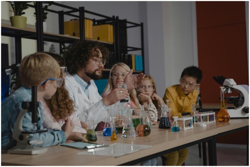 Teacher conducts a chemistry experiment using labo