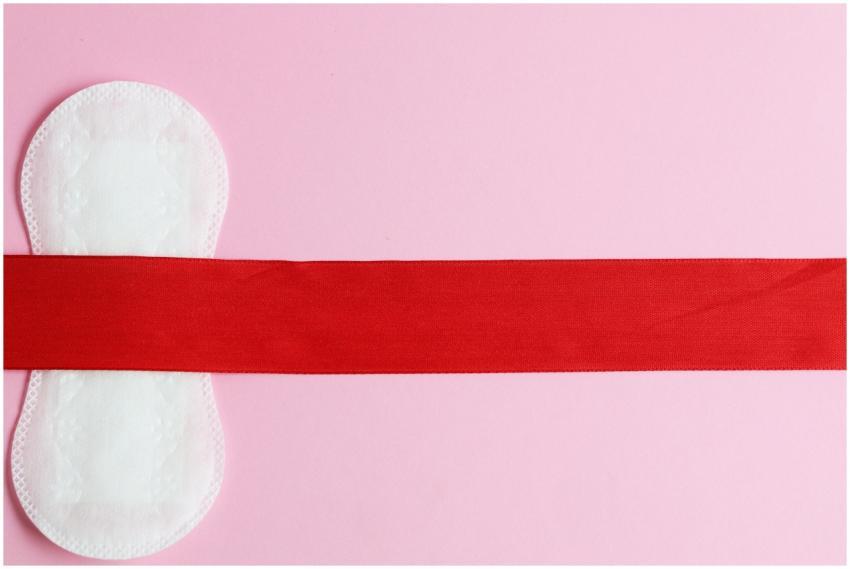 Conceptual image of a menstrual pad on a pink back