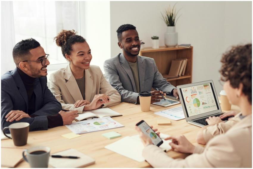 Young professionals discussing work at a conferenc