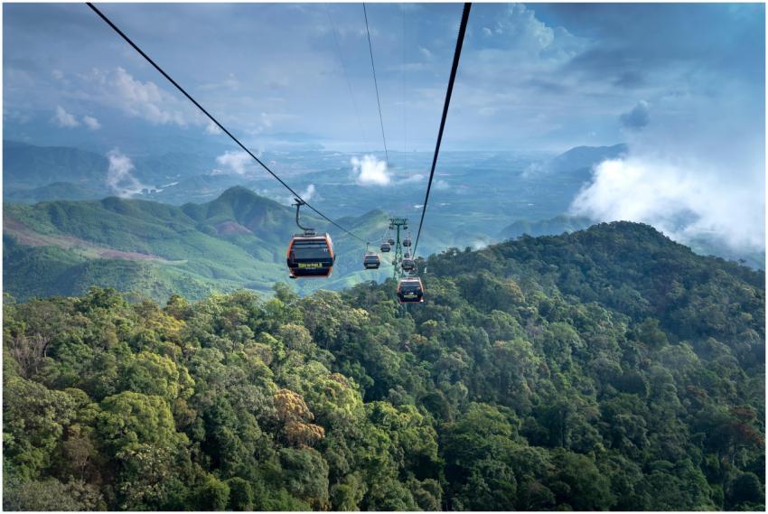 Breathtaking aerial view of cable cars gliding ove