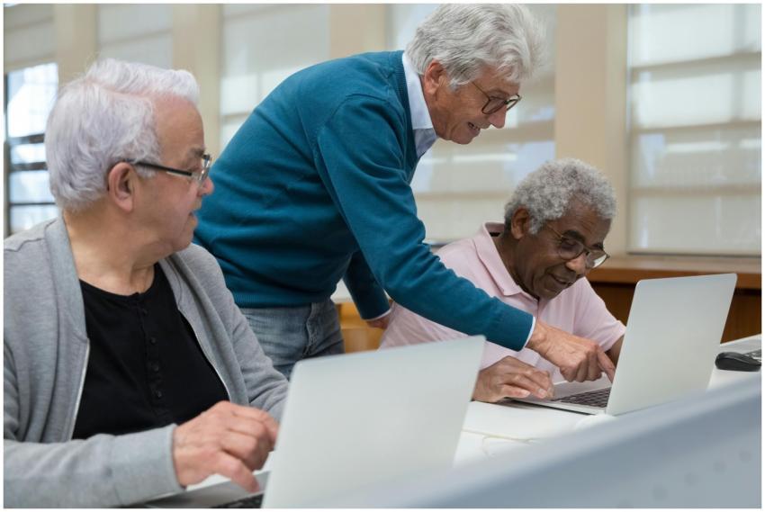 Three senior adults collaborating in a classroom s