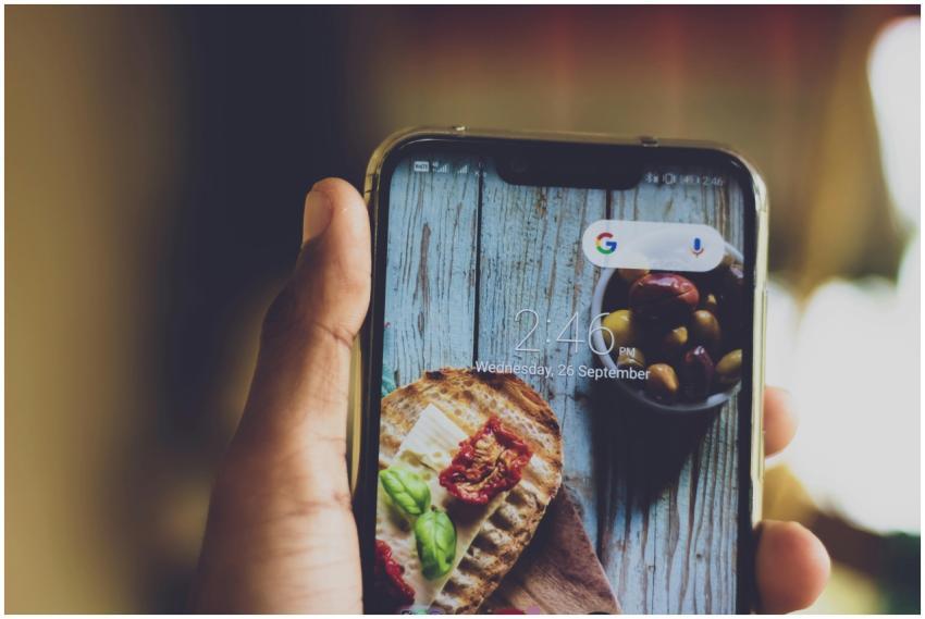 Close-up of a hand holding a smartphone displaying
