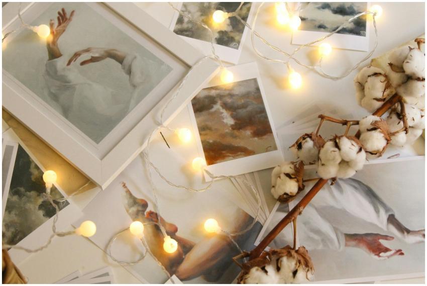 A collection of framed art pieces, cotton flowers,