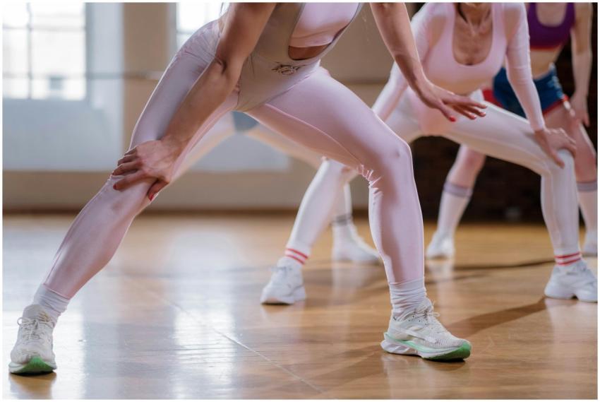 Women in a bright studio engaged in a group fitnes
