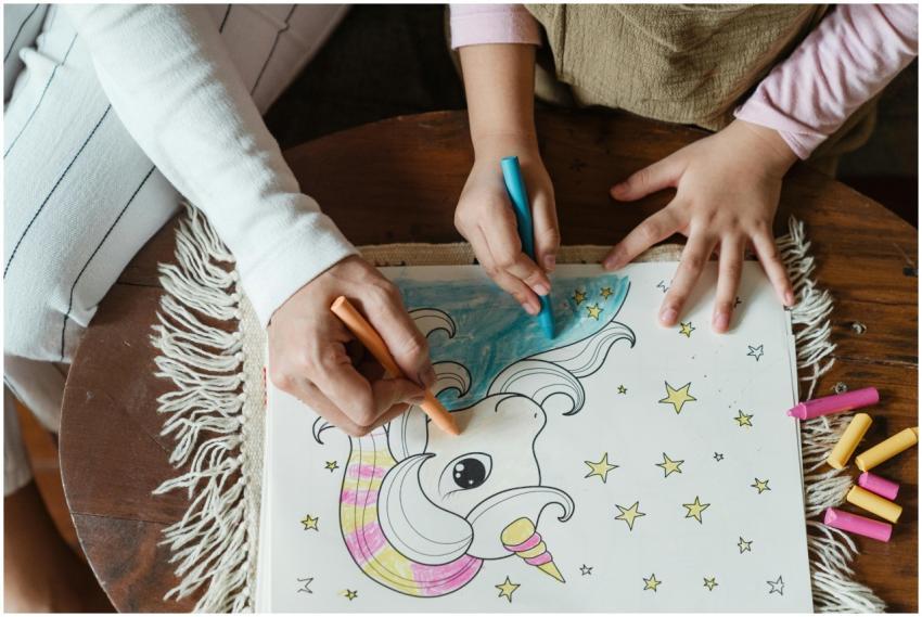 A mother and child enjoying a coloring activity wi