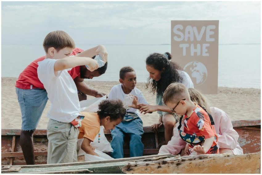 A group of children volunteering to clean a beach