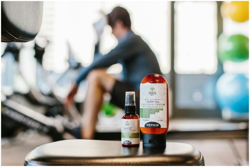 Close-up of hemp oil products in a gym focus on we