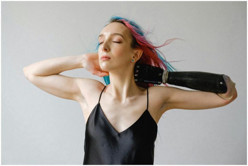 Elegant woman with prosthetic arm in serene pose,