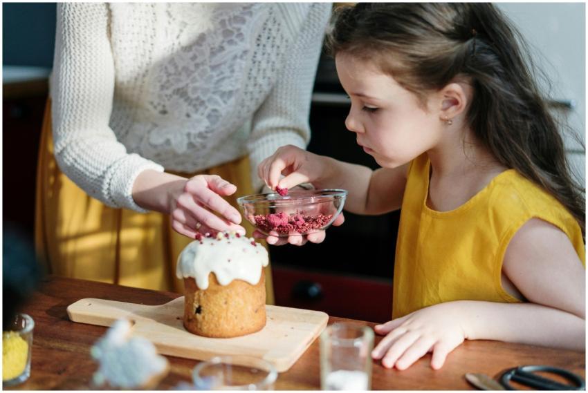 A mother and daughter bonding while decorating an