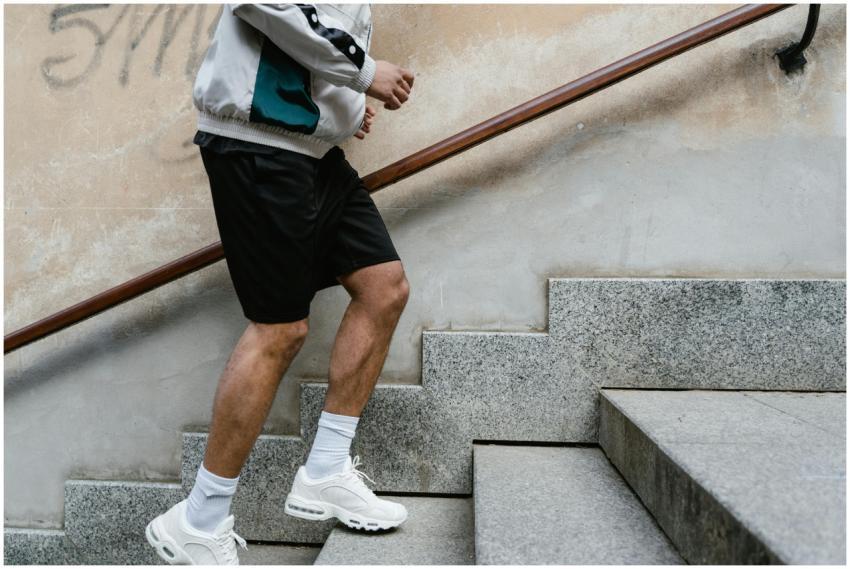 Close-up of a man running upstairs for fitness exe