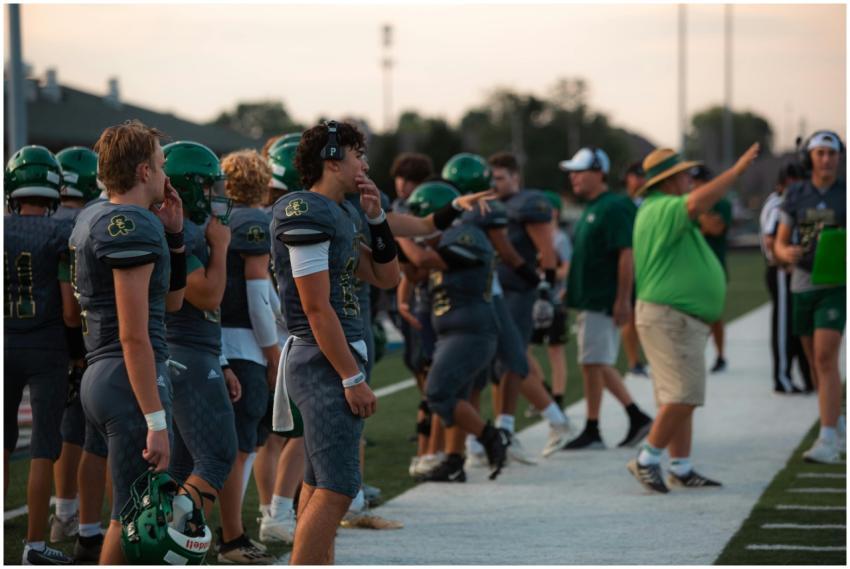 High school football team at the sideline during a