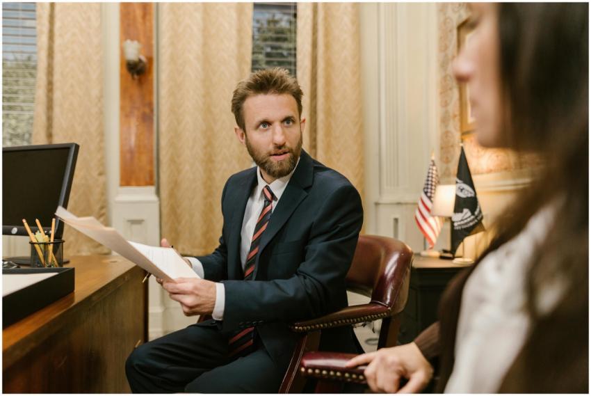 Businessman in suit discussing legal documents in