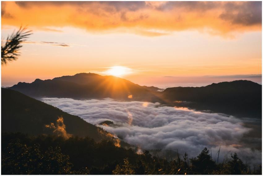 Captivating sunrise over mountain range with cloud