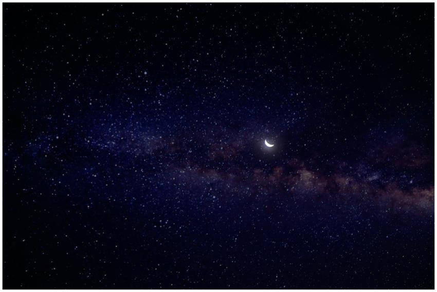 A serene view of a crescent moon nestled in a star