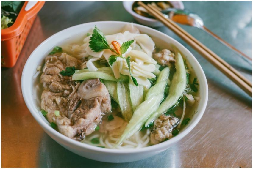 Delicious bowl of Vietnamese pho with pork and fre