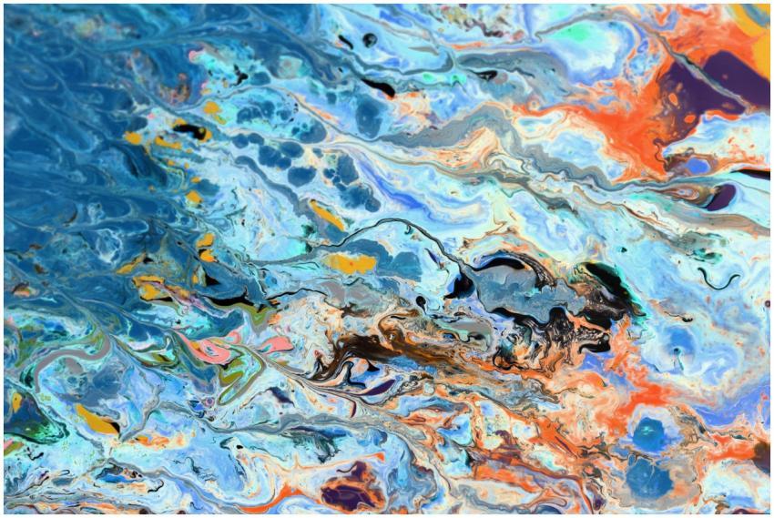 Colorful abstract swirl of paint blending blues, o