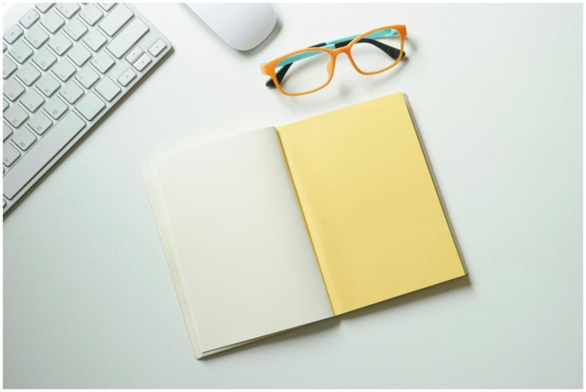 Top-down view of a clean workspace featuring a key