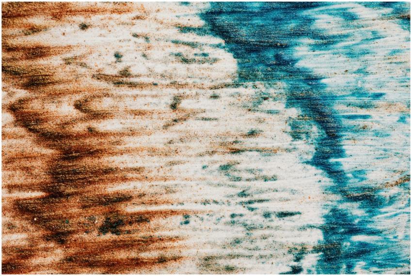 Vibrant abstract texture with blue and brown sand
