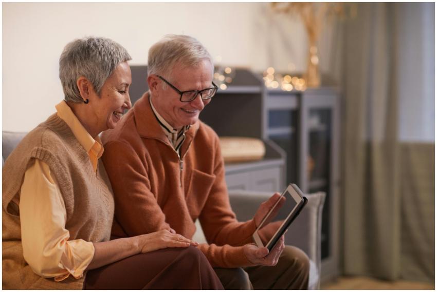 A cheerful senior couple enjoying a video call on