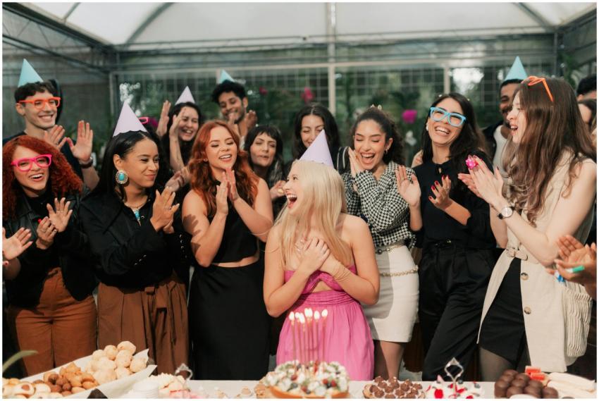 A group of friends joyfully celebrating a birthday