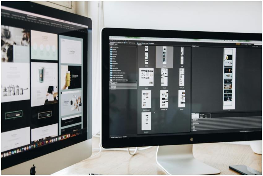 A modern workspace featuring dual computer monitor
