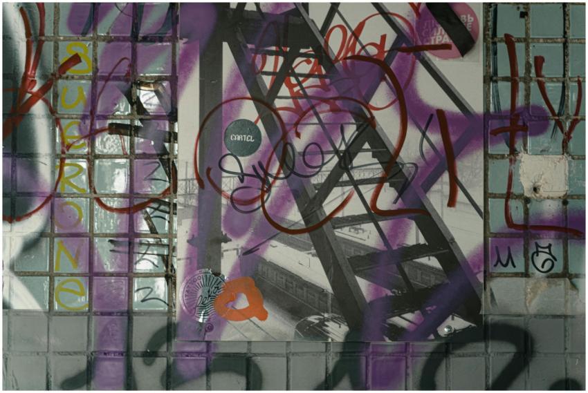 Colorful graffiti art covering a tiled wall in an