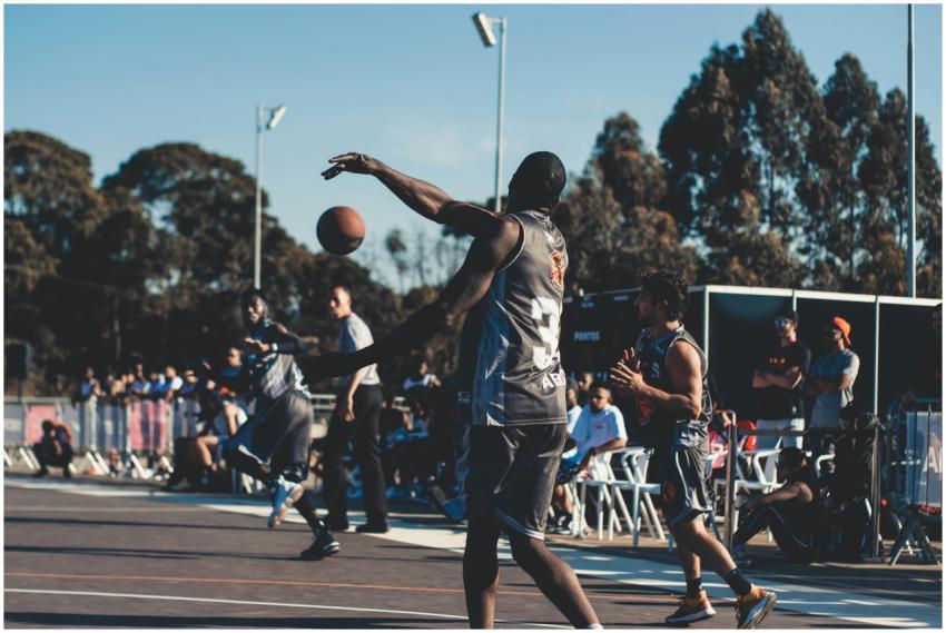 Players enjoy a competitive outdoor basketball gam