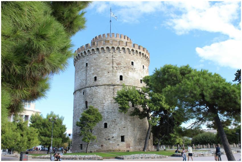 Historic White Tower in Thessaloniki with lush gre