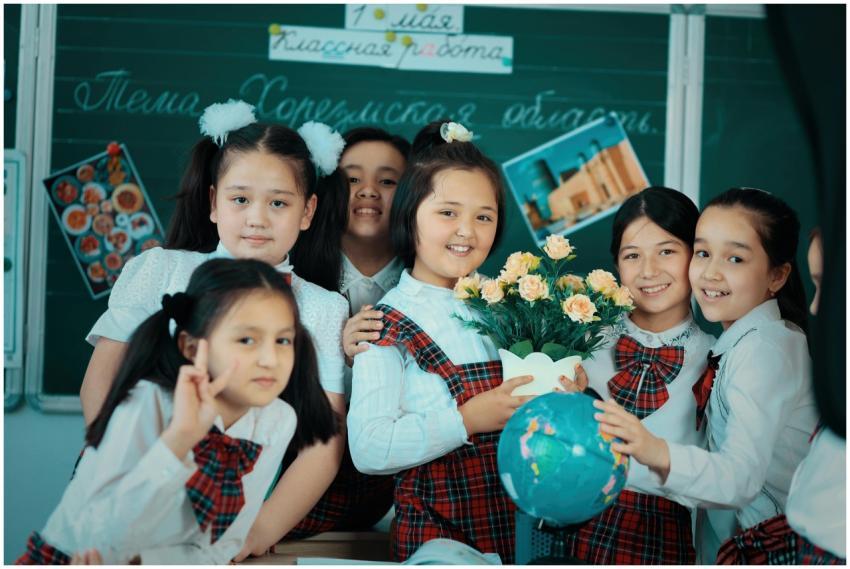 Group of schoolchildren in uniforms gathered aroun