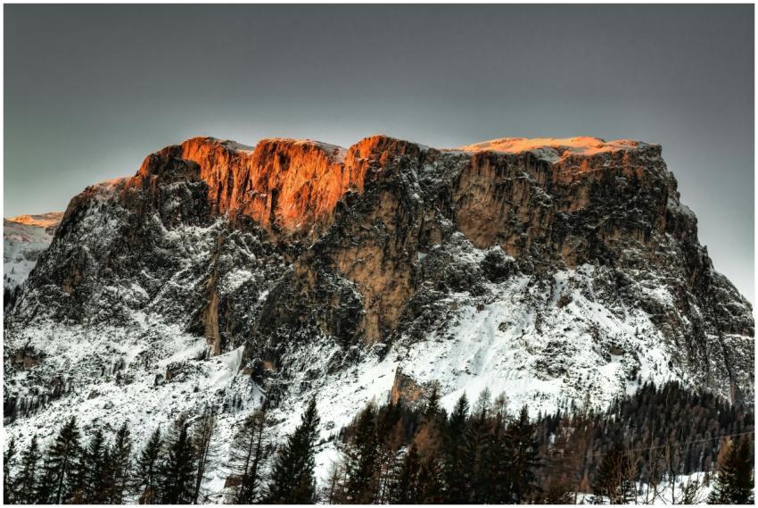 Stunning snow-capped mountain peak illuminated by