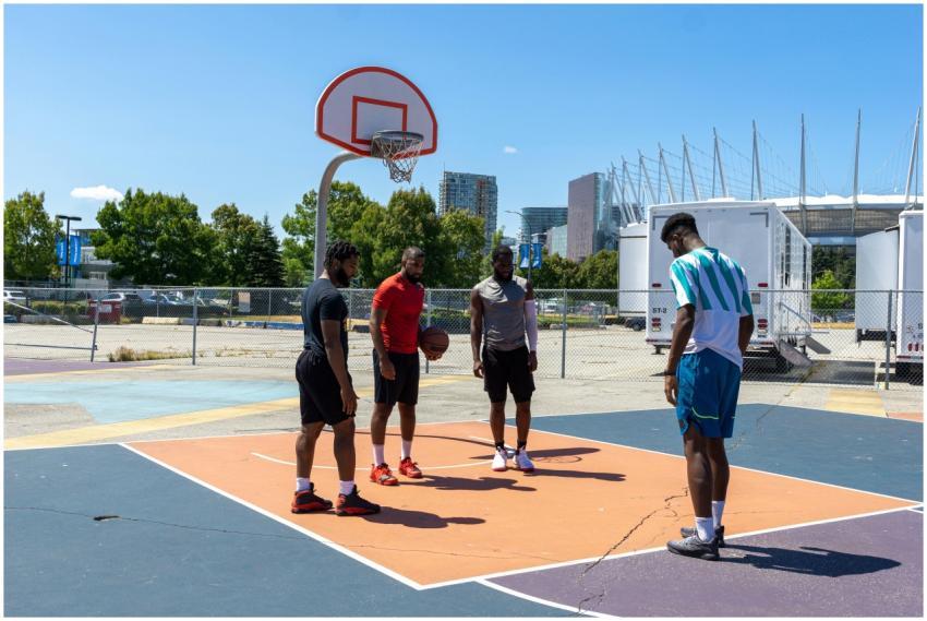 Diverse group of men practicing basketball outdoor