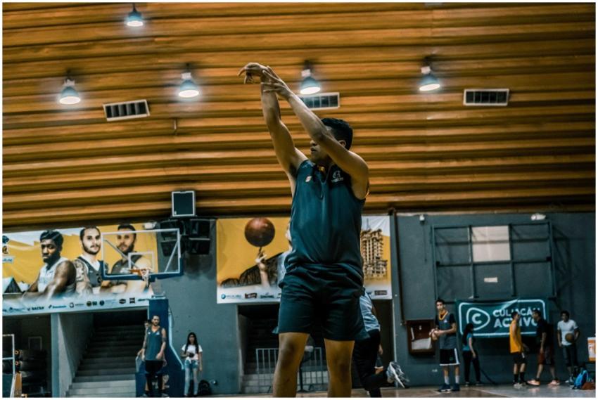 A basketball player takes a shot during practice i