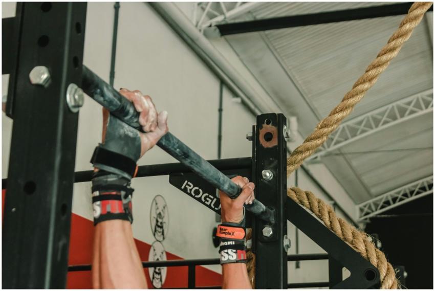 Close-up of hands gripping pull-up bar during an i