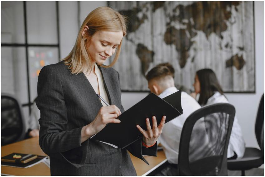 Confident businesswoman in formalwear taking notes