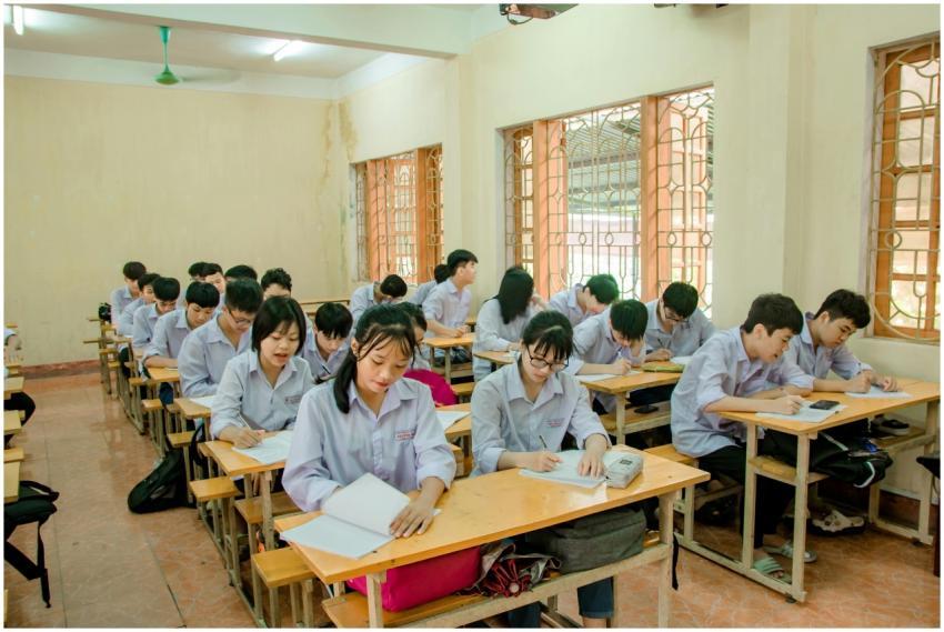 Students attentively studying in a bright classroo