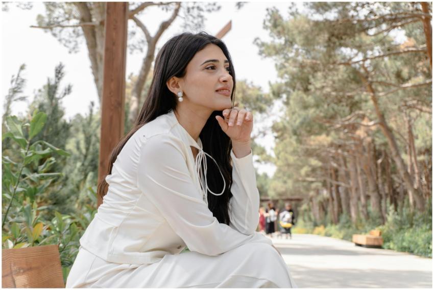 Contemplative Woman Sitting Outdoors