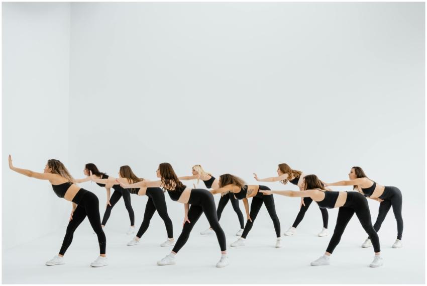 Women performing synchronized dance routine in a m