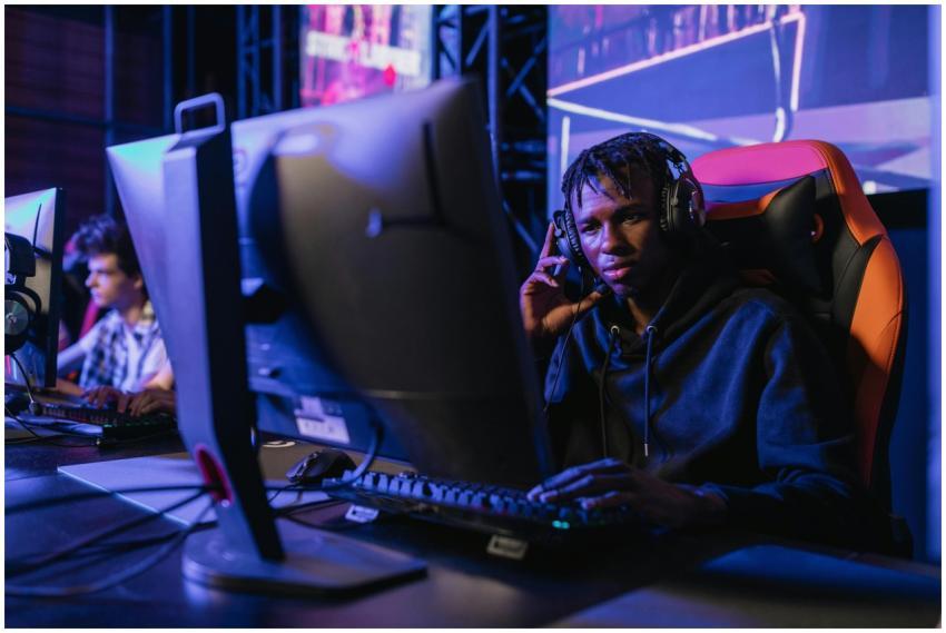 Young man immersed in competitive gaming at an eSp