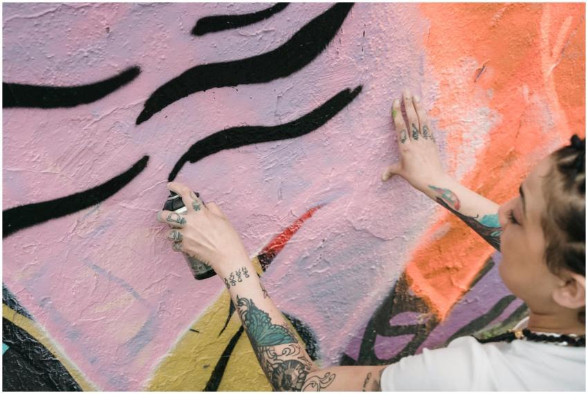 A close-up of a street artist painting a colorful