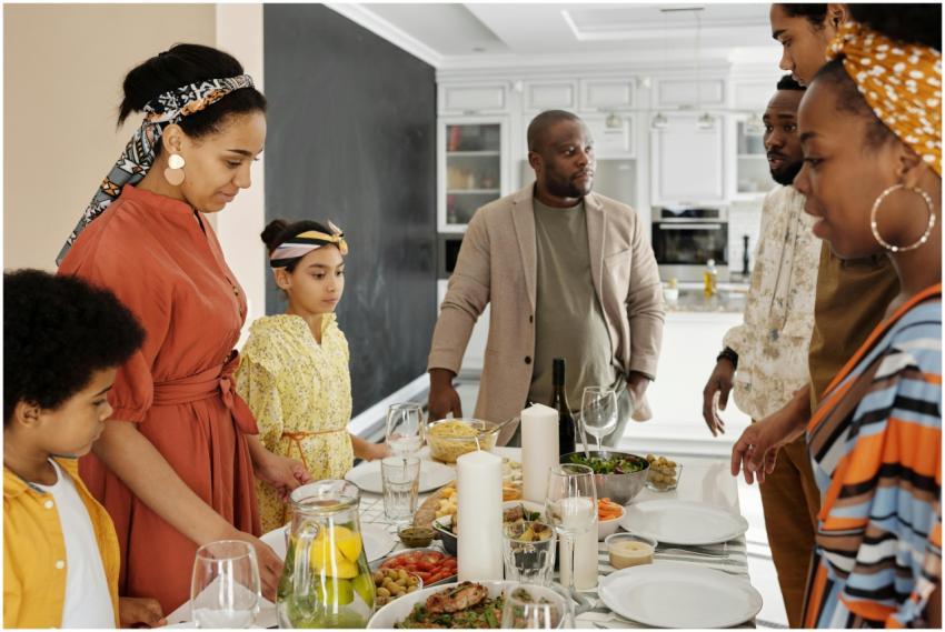 A warm family gathering around the table for a mea