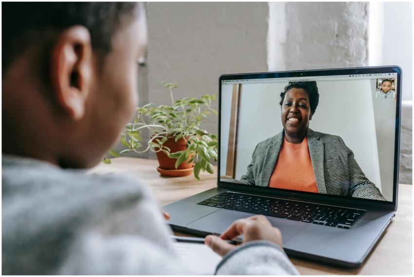 A child engages in a remote learning session with