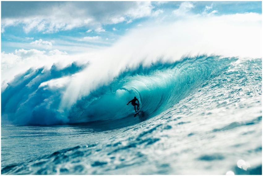 Dynamic image of a surfer mastering a giant wave w
