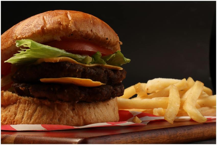 Mouthwatering close-up of a cheeseburger with lett