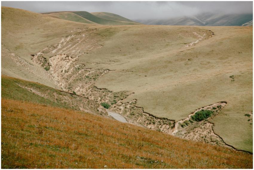 Scenic view of hilly terrain with natural erosion