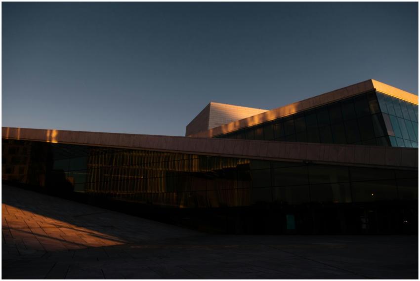 A modern architectural facade at dusk showcasing t