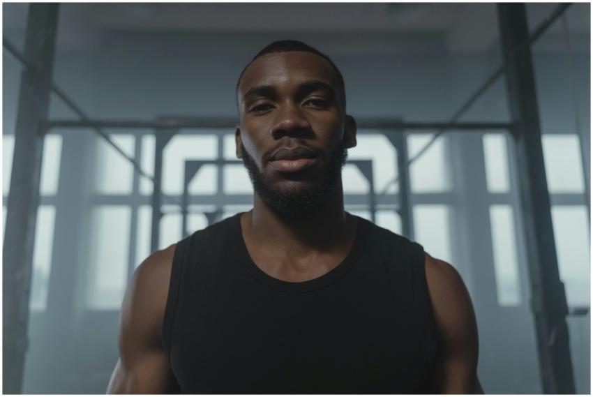 Portrait of a confident athlete training indoors,