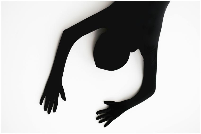 Minimalist abstract silhouette of a person on a wh